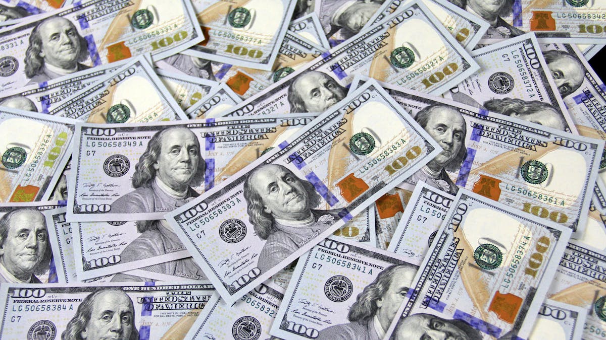 Friends splitting a bill at a restaurant while traveling